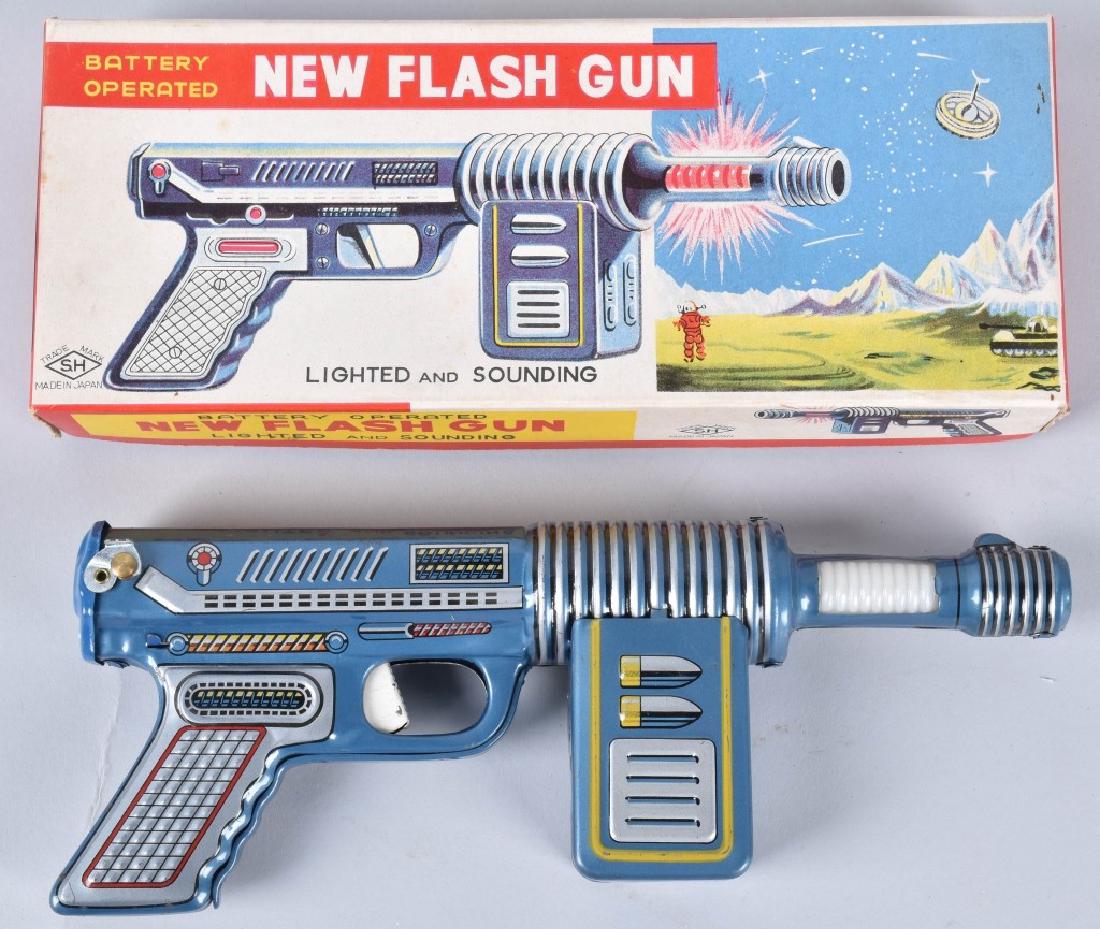 JAPAN Battery Op NEW FLASH SPACE GUN w/ BOX: Scarce battery operated New Flash Space Gun. Looks never played with condition. Comes with original box with great space graphics show Robby The Robot. 10" Excellent ex Paul Lips collection