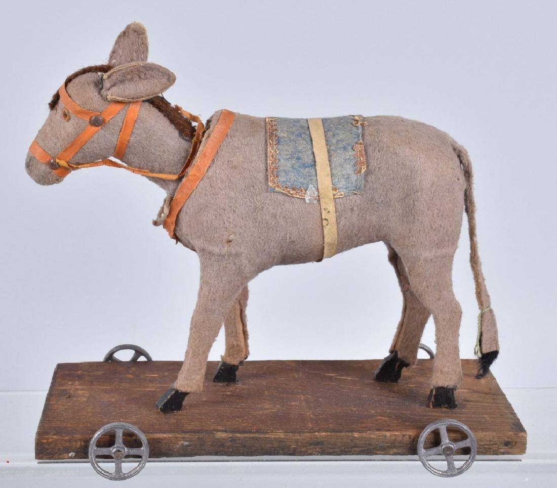 COMPOSITION DONKEY NODDER ON PLATFORM w/ WHEELS (1 of 3)