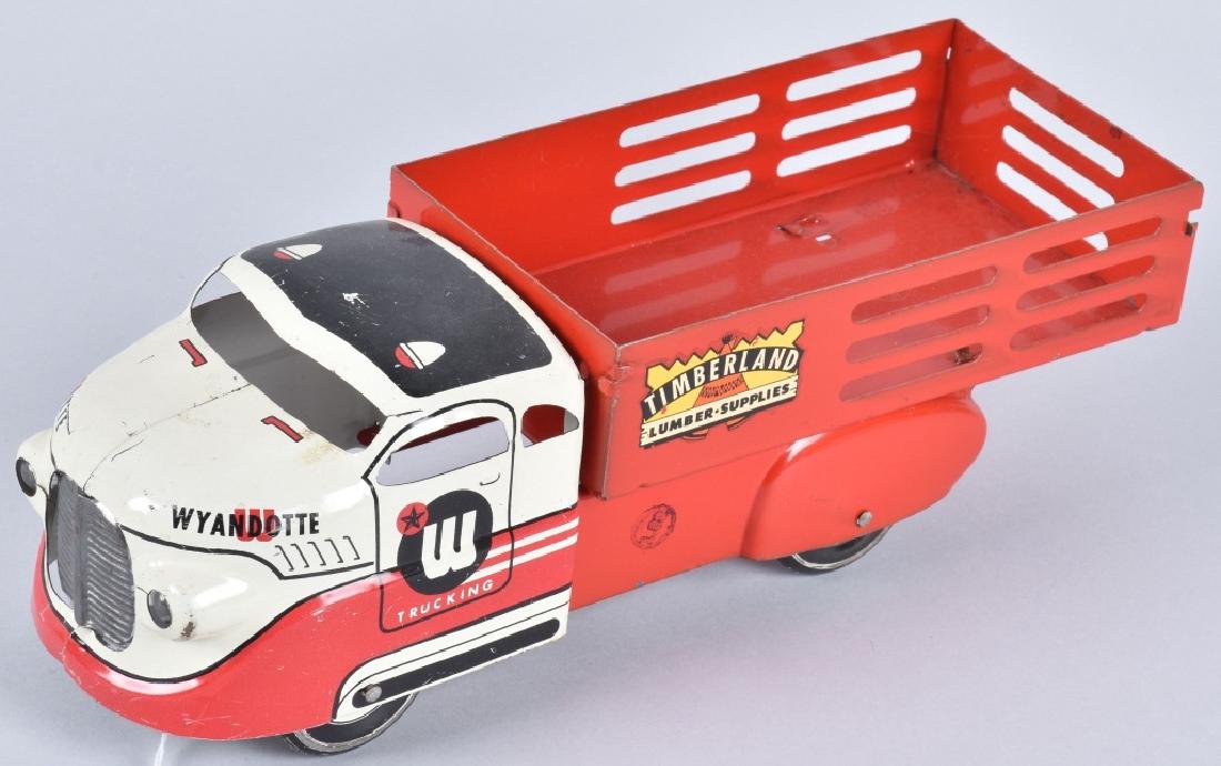 WYANDOTTE TIMBERLAND LUMBER STAKE TRUCK: 13" long, nice colors and detail, price stamp on frame. Metal wheels. Light wear. Excellent
