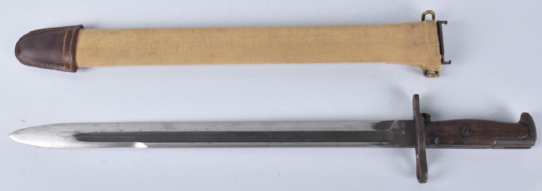 1905 SPRINGFIELD ARSENAL BAYONET & SHEATH: 20 1/2" overall, nicely marked blade dated 1917 and serial numbered, sheath looks like it is un-issued or of later manufacture. Very Good-Excellent