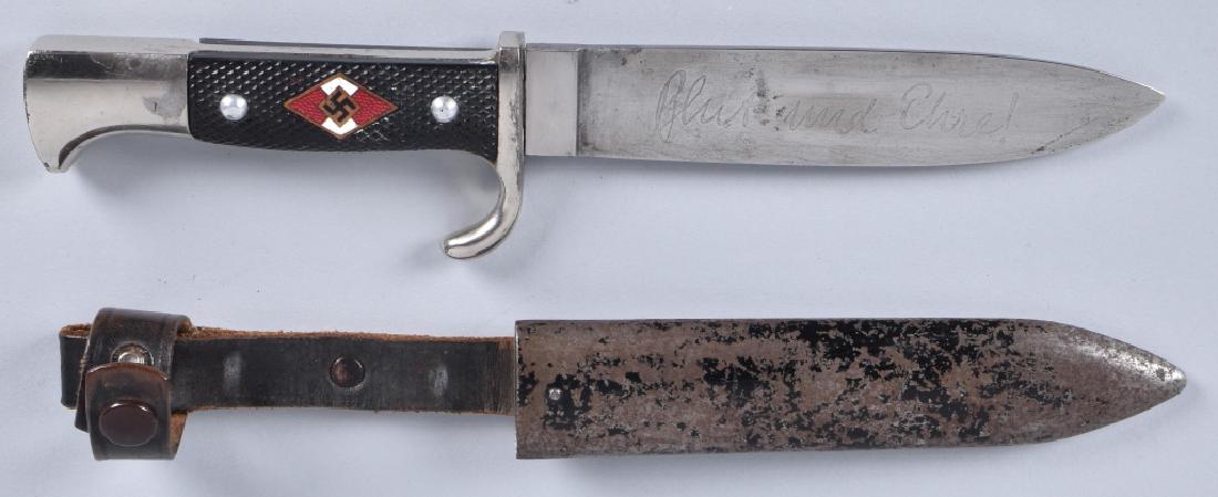 WW2 HITLER YOUTH DAGGER and SHEATH: 9 1/2" overall, nicely marked blade with RZM number M7/37. Blade is nice and is maker marked F.W. Holler Solingen. Nice grips, Metal sheath has paint loss, but retains leather frog. Very Good