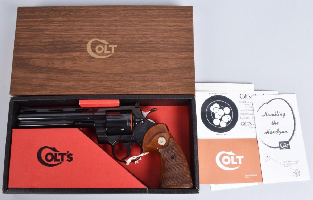 COLT PYTHON .357 MAGNUM, BOXED E SERIES 1971: SN E22824, 6" barrel, gun appears unfired with plastic cylinder protective ring, and string tag. Beautiful condition, and includes paperwork, and pristine original box. Near Mint