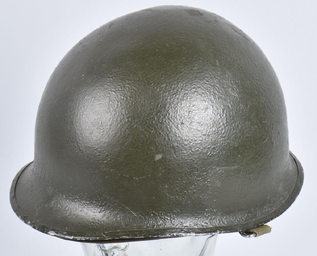 WW2 ID'd FRONT SEAM M1 HELMET: Liner is identified and has applied 1st and 2nd Division insignia. Front seam with swivel bales. Helmet is the usual post war repaint. Very Good
