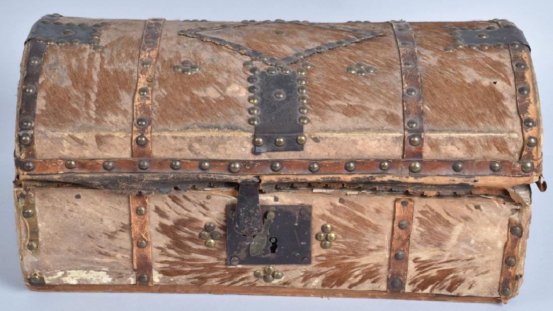 18th CENTURY HIDE COVERED TRUNK: 18"by 10" by 8", dome shaped trunk, covered with deer hide and lined with period wall paper. Nice tack design. Many officers in the Revolutionary war used similar trunks for important paper and person