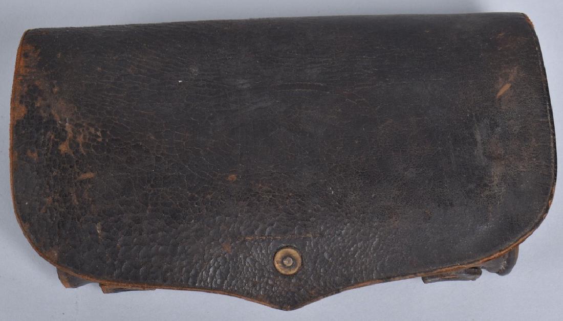 1870'S INDIAN WARS HAGNER TYPE 2 CARTRIDGE BOX: Designed in 1872 by Colonel Paul V. Hangner. Flap is embossed US, and holds 24 cartridges with a side pocket for a combination tool. Very Good