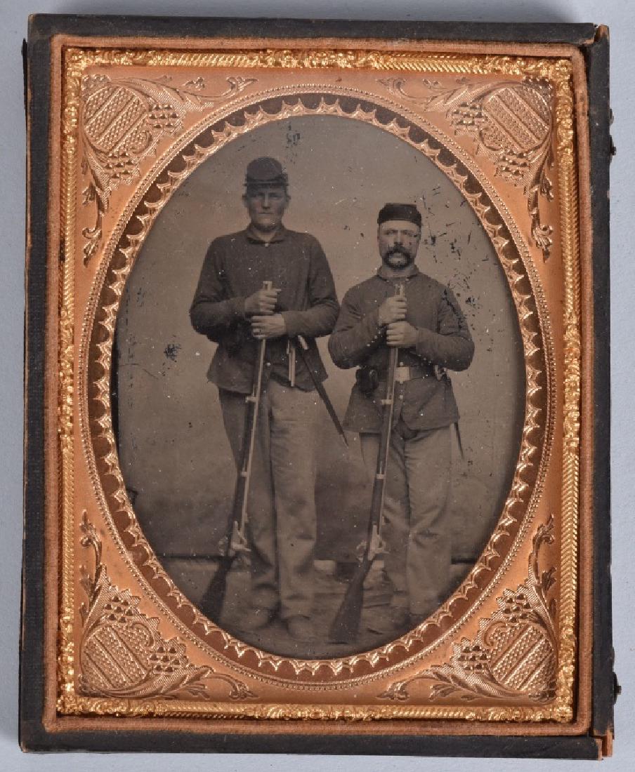 CIVIL WAR 1/4 PLATE TINTYPE 2 ARMED FEDERALS: Nice image of 2 soldiers armed with m1861 Springfield rifles, and the taller of the two has a Colt in his belt. Nice clarity and contrast some minor loss, Housed in a half leatherette case. Very Good