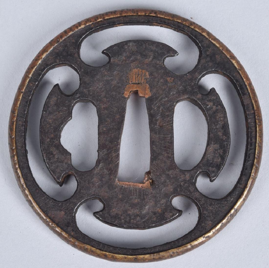 JAPANESE CAST IRON TSUBA: 2 1/2" diamter, cast iron, well made with applied brass rim. Has copper blade shims. Very Good
