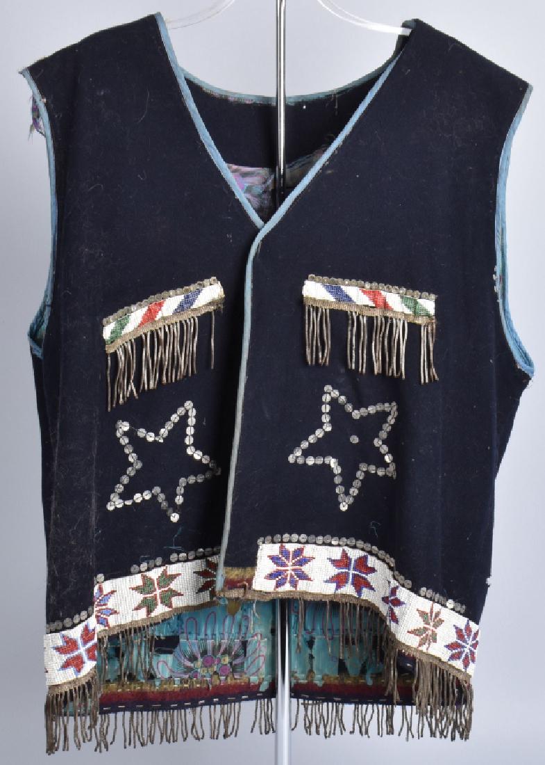 VINTAGE NATIVE AMERICAN BEADED VEST: Blue wool vest with cloth lining, nice beaded decoration on front and reverse. Has some soiling, and wear to lining. Good-Very Good