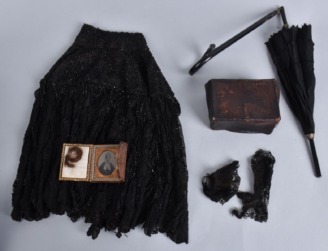 CIVIL WAR ERA ID'd WIDOWS MOURNING GROUPING: Nice grouping with ID'd ambrotype and lock of hair in case, Leather sewing kit, black lace gloves, beaded mourning cloak, and folding black mourning umbrella. Condition varies. Overall Very Good