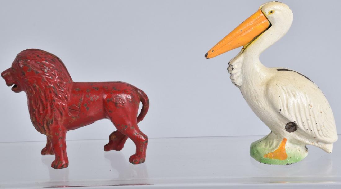 CAST IRON PELICAN & LION STILL BANKS (1 of 5)