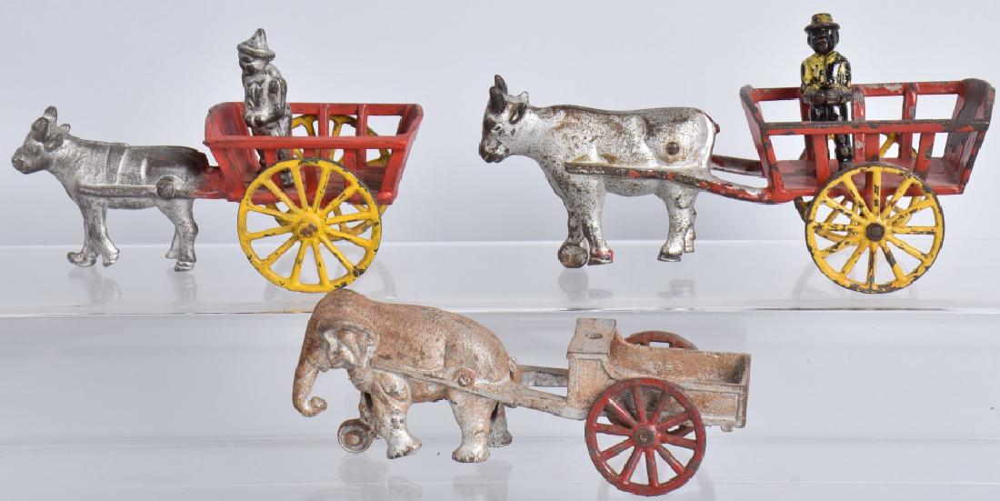 3-CAST IRON TOY ANIMAL DRAWN WAGONS (1 of 4)