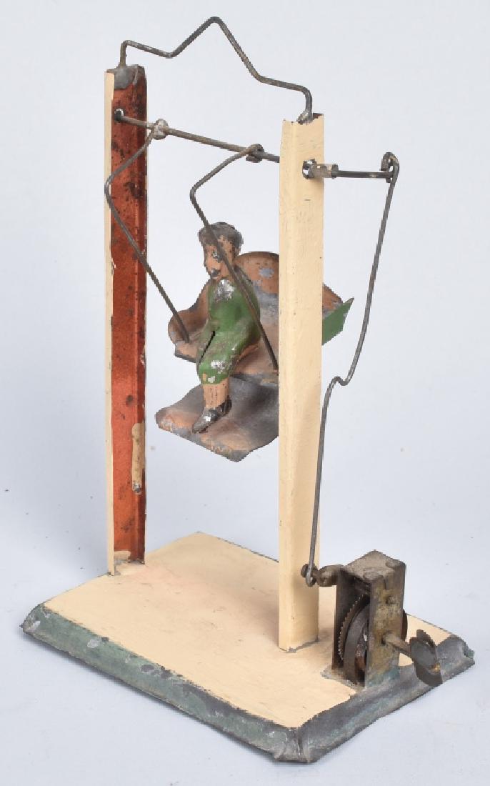 GERMAN HAND PAINTED WINDUP BOY ON SWING (1 of 9)