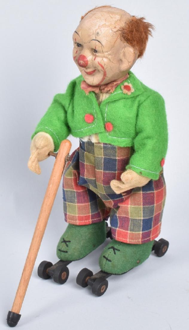 SCHUCO WINDUP CLOWN ON ROLLER SKATES (1 of 5)