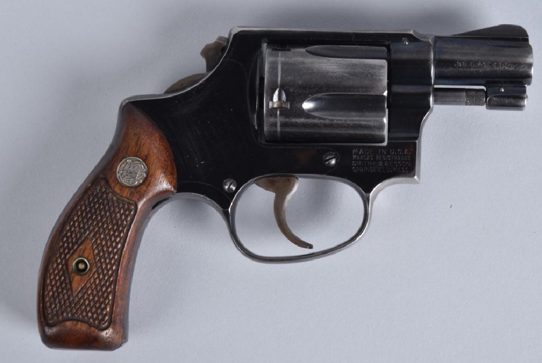 SMITH & WESSON .38 REVOLVER MODEL 38: SN 235805, snub nose 1 7/8" barrel with excellent bore, strong action, 70% blue finish, good wood grips. Bobbed hammer. Very Good*