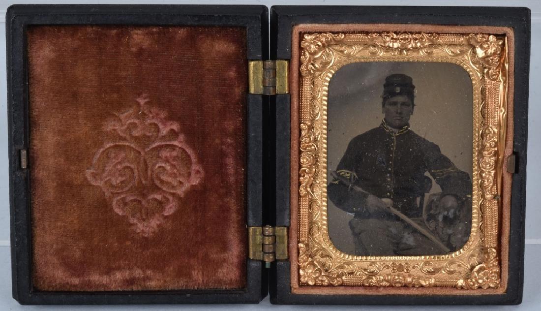 CIVIL WAR 1/9 PLATE ARMED FEDERAL TINTYPE: Nice image of cavalry sergeant housed in a nice thermo-plastic Union Case. The case is made by Littlefield, Parsons & Co, and is dated 1857. The image has nice contrast and clarity. Very Good-Excellen