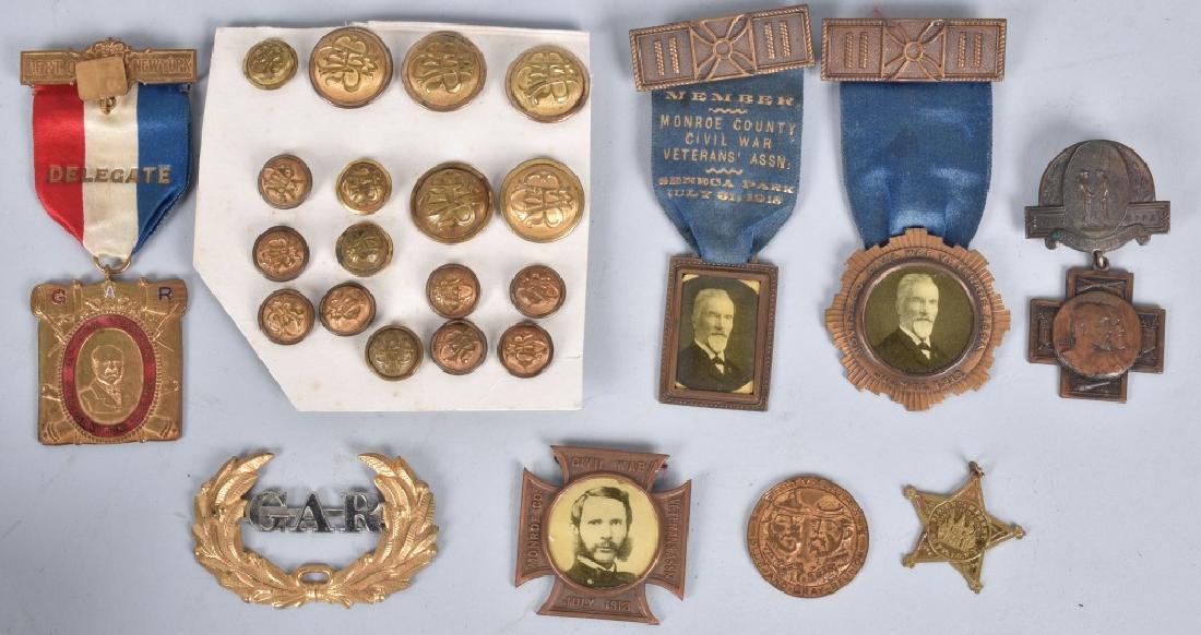 GAR MEDAL and BUTTON GROUPING: Civil War GAR lot including buttons, a hat device and Monroe County, New York GAR medals. These medals include a Gettysburg 75th anniversary medallion, a Gettysburg 50th anniversary badge, and a medal