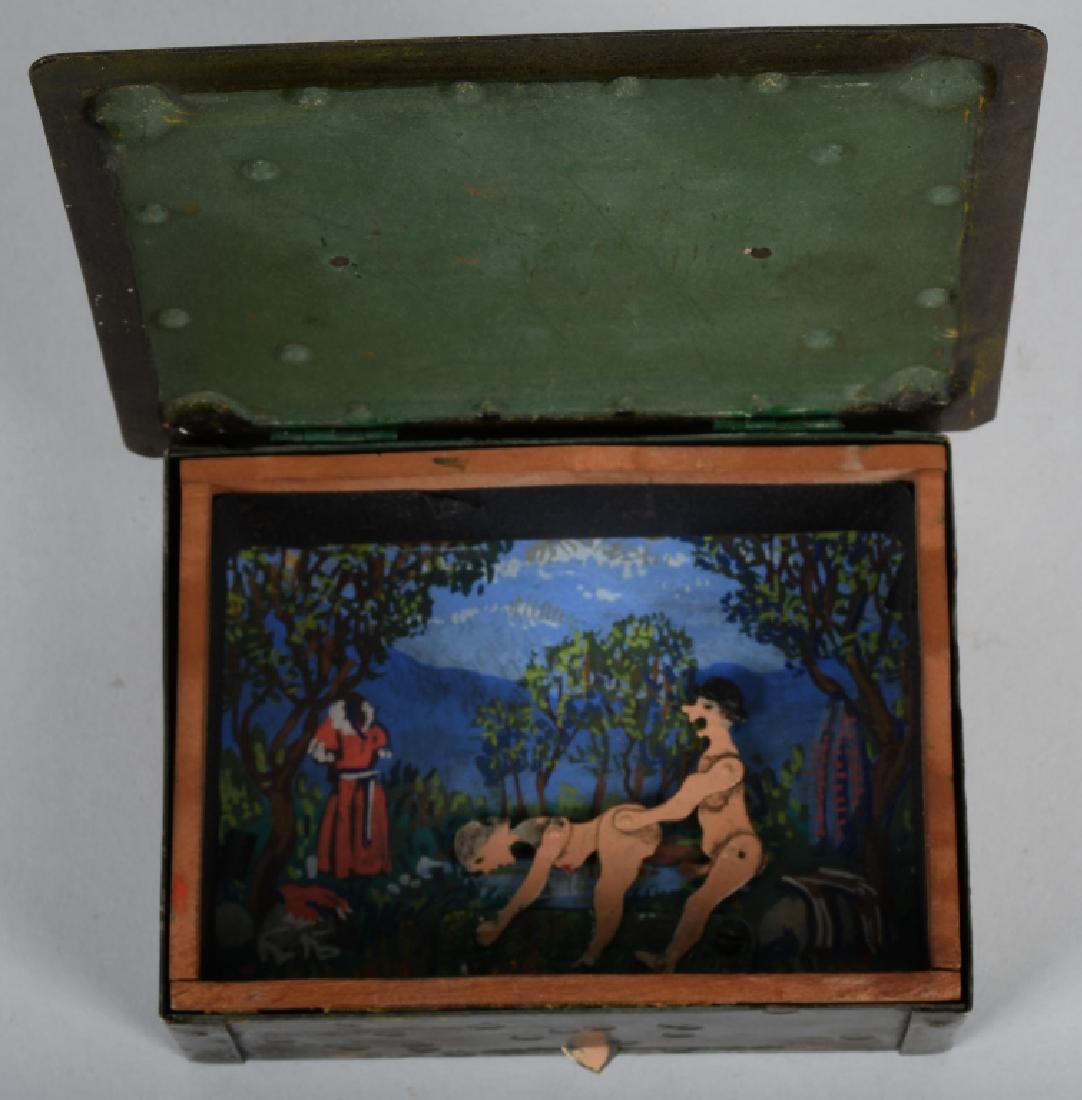 FOLK ART EROTIC METAL TRINKET BOX: Unusual metal trinket box with wood lined interior. Has mechanical erotic scene of man and woman having sex. You slide the lever and make the figures move. 5 1/2" Excellent