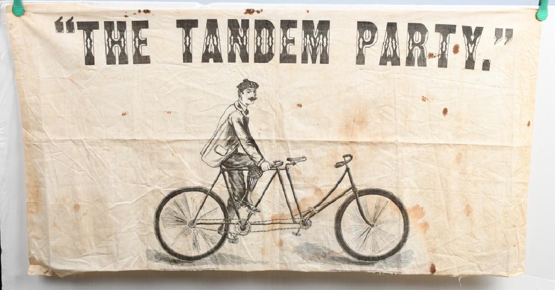 1897 TANDEM PARTY BICYCLE GAME: Original 1897 Tandem Party Bicycle Game. Cloth board with man on bicycle built for 2. Was played similar to pin the tail on the donkey. Some soiling. 35"x19"