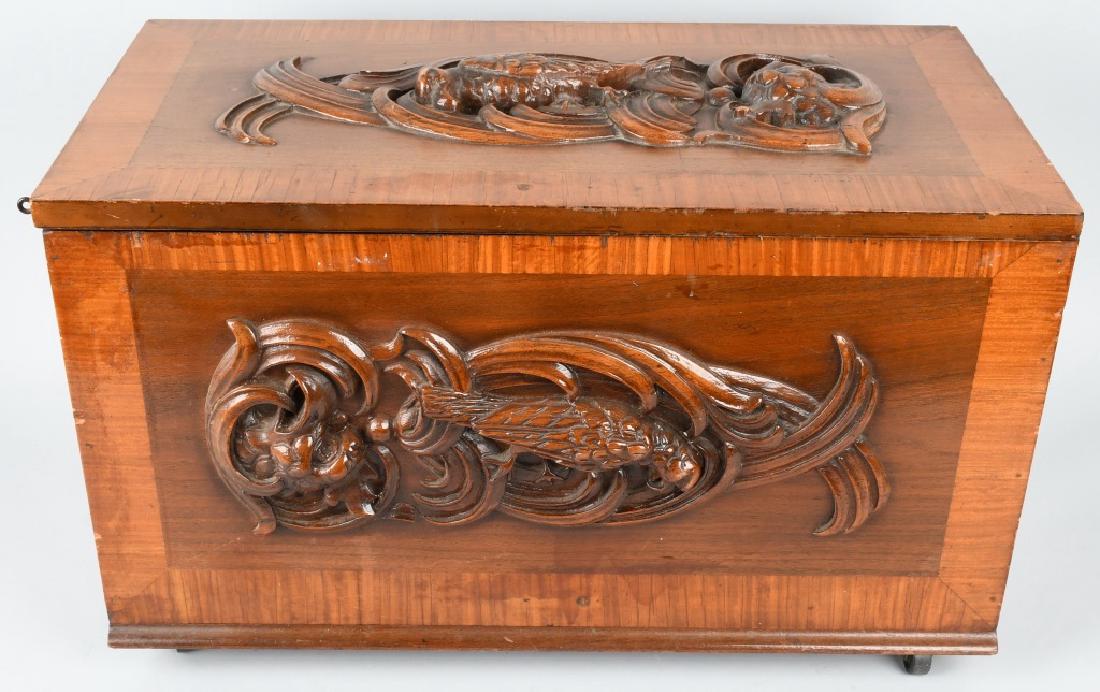 WOOD CHEST w/ CARVED EAGLE DESIGN: Very well made wooden chest with carved Eagle design on top and front. Very ornate. Chest is set on wheels. 28"x14"x16" Excellent