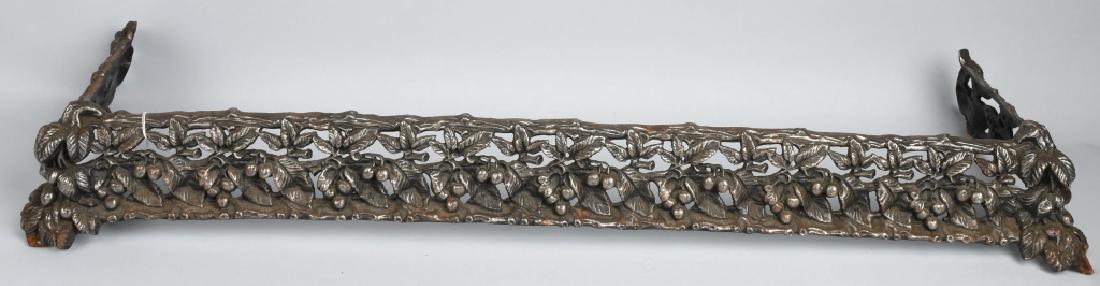 CAST IRON ORNATE FIREPLACE BASE: Ornate cast iron Fireplace Base. Looks to be a cherry tree pattern. Has nickel finish. 47"x13" Excellent