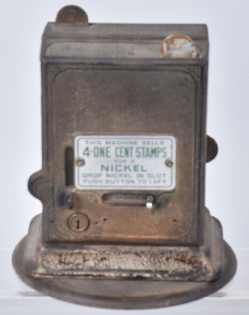 5 & 10 CENT SCHERMACK CAST IRON STAMP VENDOR: Vintage coin operated cast iron stamp machine. Measures 8 1/2" by 6 1/2". Has a slot for a nickel on one side and a dime on the other. Good-Very Good
