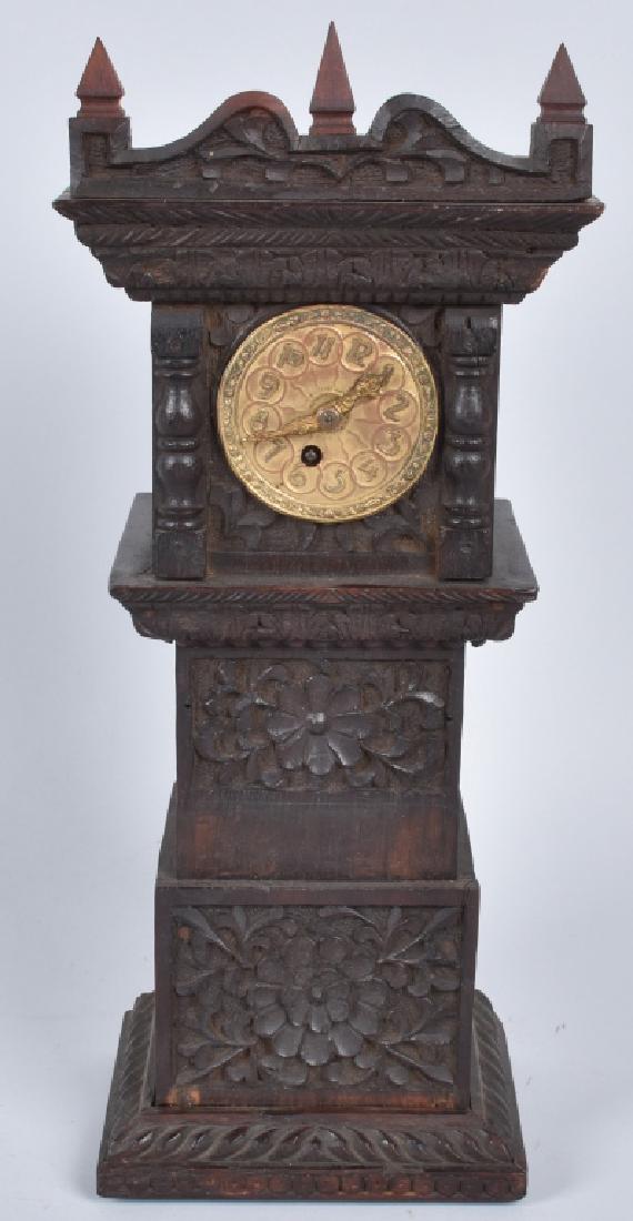 BLACK FOREST MINIATURE CARVED GRANDFATHER CLOCK: 14 1/2" by 5 1/2" by 4", great carved details. Clock is untested. Very Good-Excellent