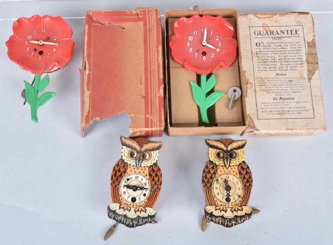 4-GERMAN and LUX NOVELTY CLOCKS and MORE: Nice lot includes 2 Lux flower clocks, one with the original box. Also included are 2 German Owl clocks with moving eyes, missing pendulums, and an empty original box for a Keebler clock. Condition va