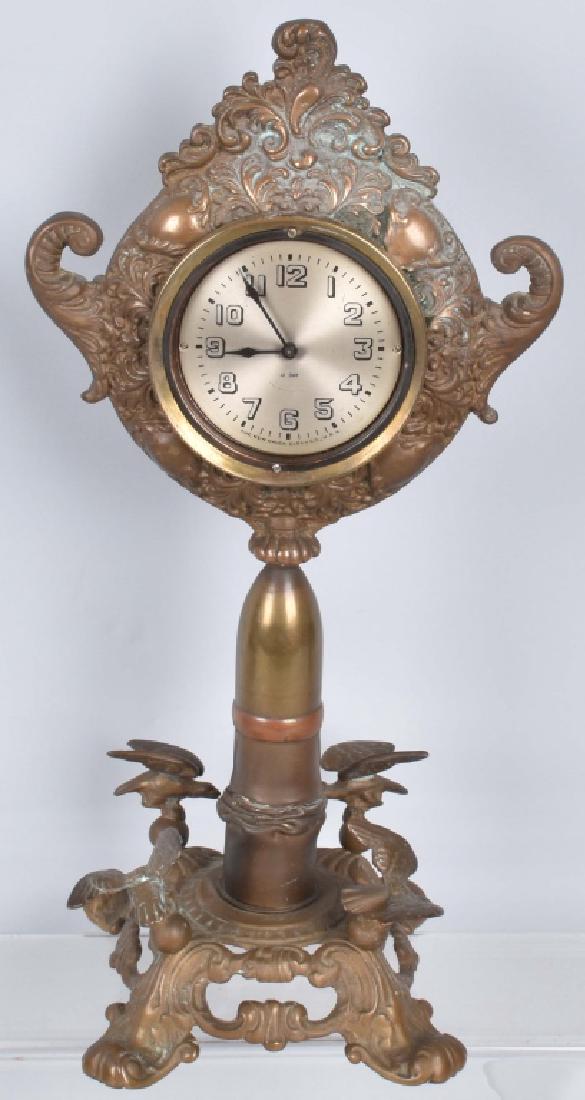 NEW HAVEN CLOCK w/ ARTILLERY SHELL / EAGLES BASE: Interesting 17" brass clock with artillery shell and eagles on the base. Clock worked when tested. A very unique clock. Very Good
