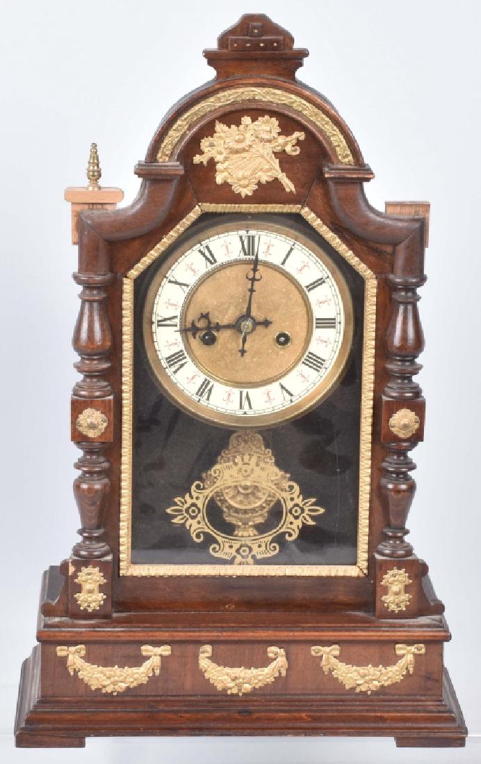 GERMAN ORNATE SHELF CLOCK, VINTAGE: 17" by 12", German clock marked T over H inside. Has brass filigree decoration. Ha some repair to top of door. Very Good