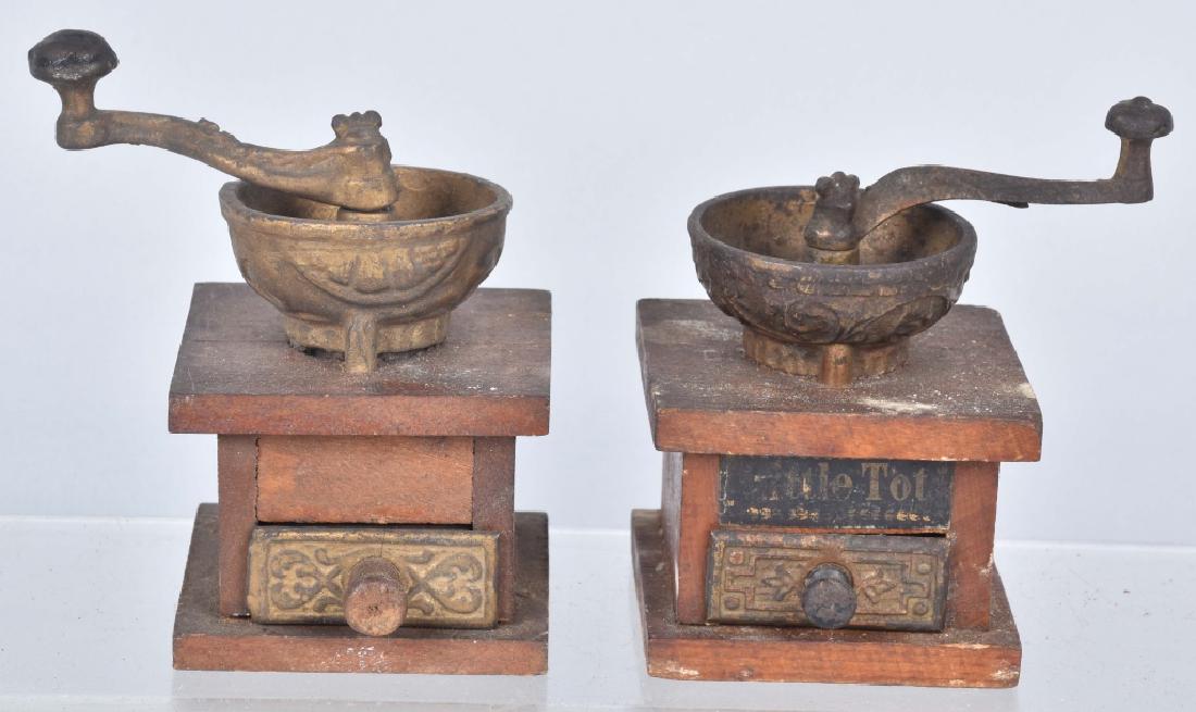2-VINTAGE ARCADE TOY COFFEE GRINDERS.: About 3" by 3" by 4". Good construction with cast iron parts. Should clean to a higher grade. Very Good