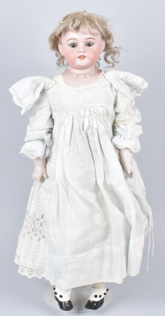 LARGE GERMAN SIMON HALBIG BISQUE DOLL: About 30", bisque shoulder head with sleep eyes and pierced ears, on leather kid body. Displays well. Very Good