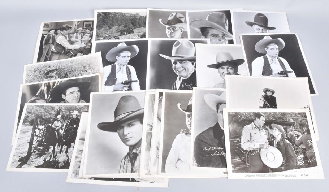 26-VINTAGE WESTERN MOVIE STILL PHOTOS: Lot includes Audie Murphy, Hoot Gibson, Tom Mix, Ida Lupino, John Wayne and many more. Very Good
