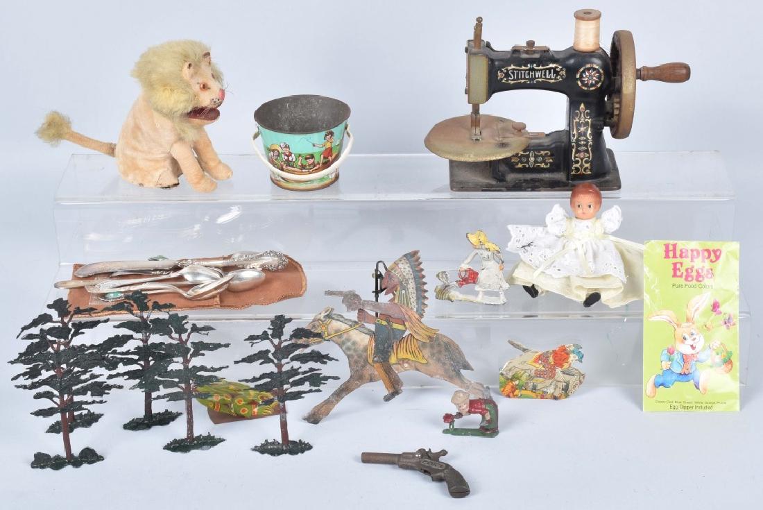 VINTAGE TOY LOT, WINDUP, SILVER and MORE: Nice lot includes working windup Lion toy made in Japan, a Garden tin candy container pail, 3 tin clickers, a cast iron Pluck cap pistol, a Stitchwell toy sewing machine and more. Also included are Me