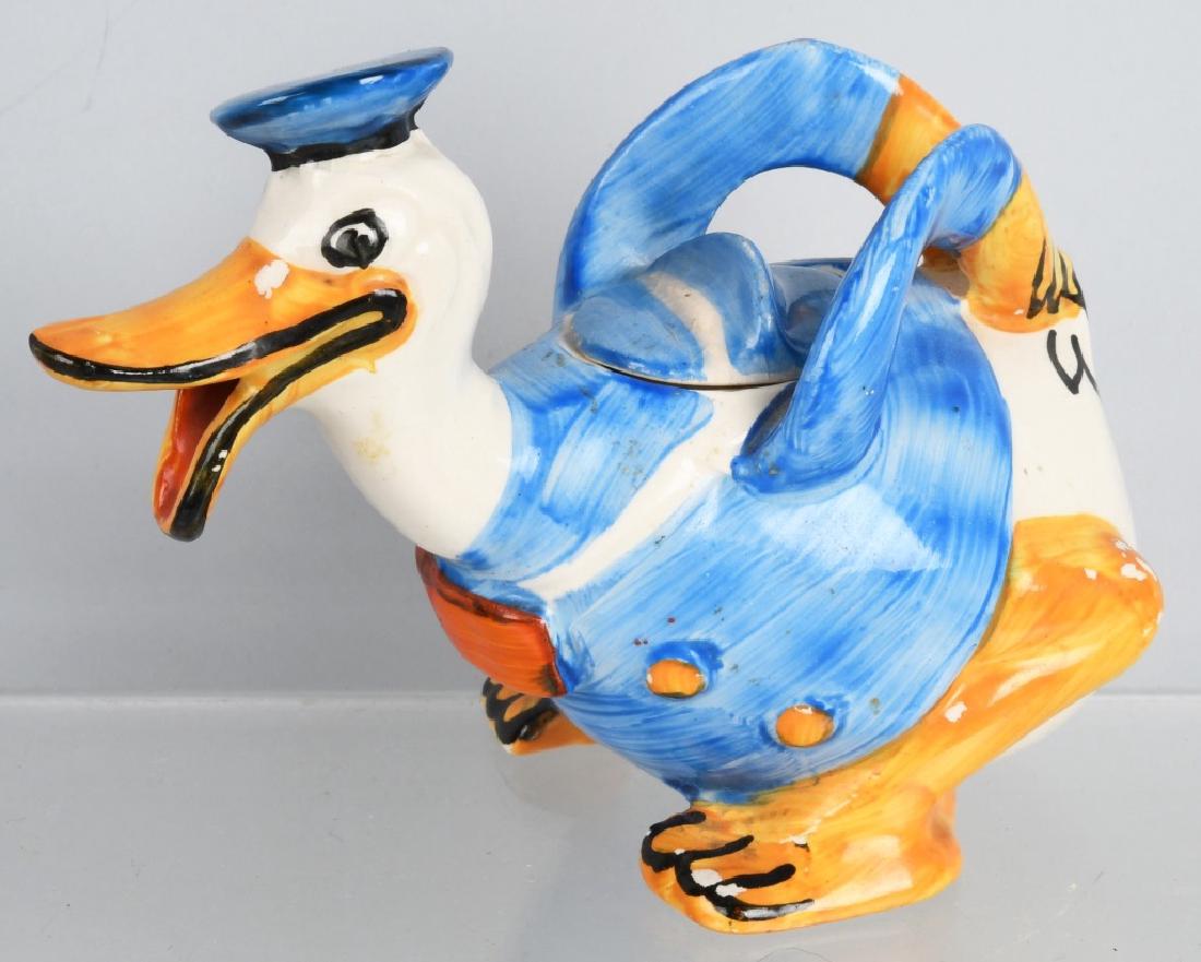 1930'S WADE DONALD DUCK FIGURAL CREAMER: 5 1/2" by 4", great long billed design and colors. Lid has edge chipping, otherwise Excellent May have some possible restoration.