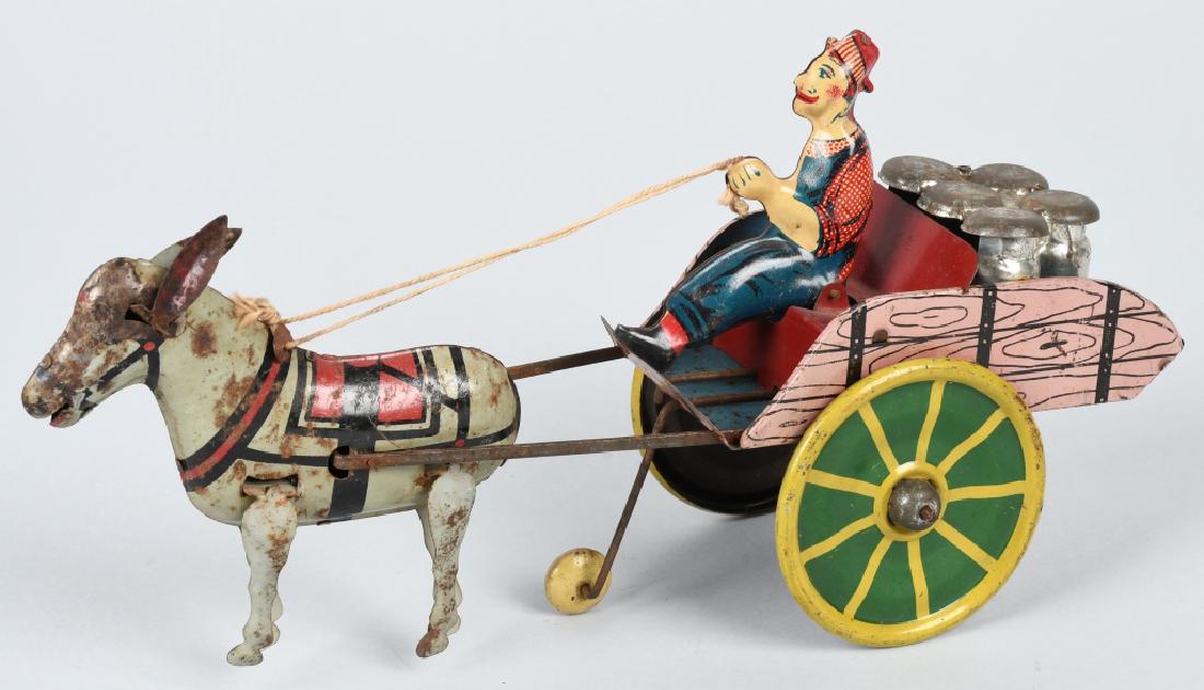 MARX 1930'S TIN WINDUP HEE HAW MILK CART: Colorful tin toy in working condition. Complete, mule has some surface rust. 10", Very Good