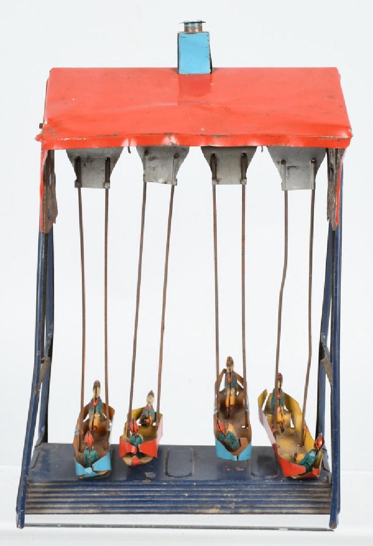 GERMAN SWINGING BOATS TOY: All original with 4 Boats with Riders. Toy has pull mech at top that made the boats swing. Need some adjustment. 8" Very Good