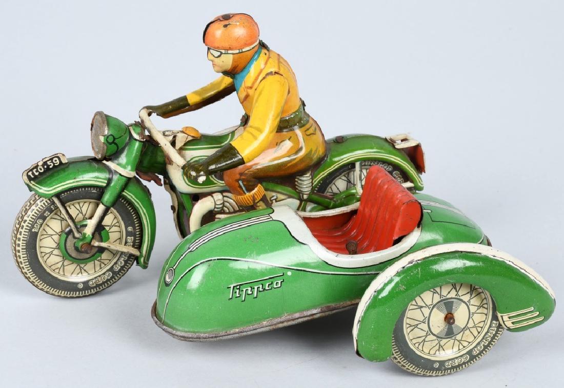 GERMAN TIPPCO WINDUP MOTORCYCLE / SIDECAR: Great looking tin windup motorcycle with sidecar. Nice colors and details. Windup is not working, and missing sidecar windshield. Very Good