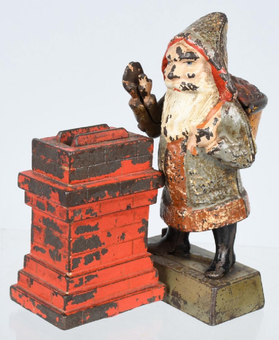 SHEPARD SANTA CLAUS CAST IRON MECHANICAL BANK: 6", very nice example with original paint and no cracks or breaks. Trap is an old replacement. Very Good