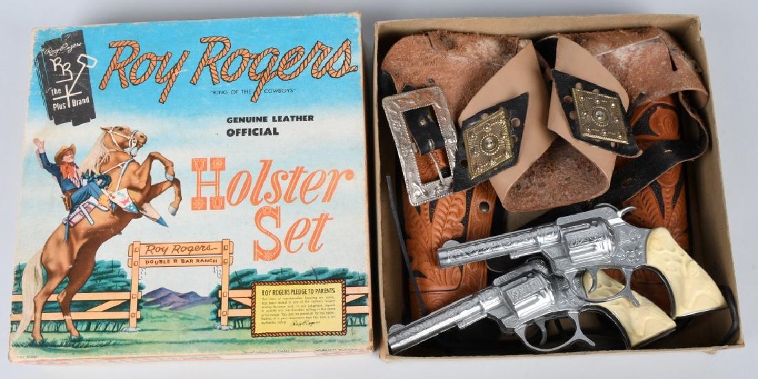 CLASSY PRODUCTS ROY ROGERS HOLSTER SET, BOXED: Great set appears unused. Comes with 2 - 7" Buck cap guns. Box measures 9 1/4" by 9 1/4". Excellent