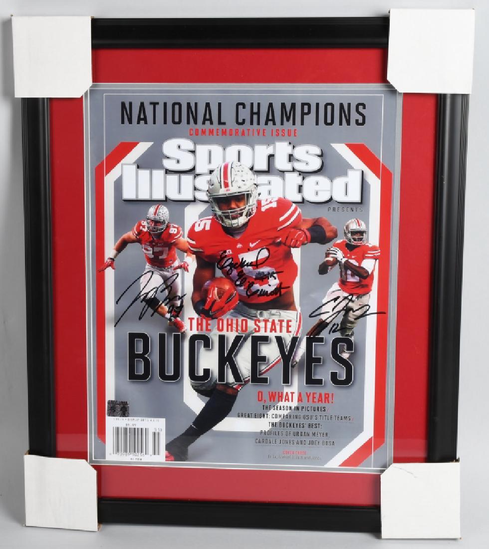 OHIO SPORTS ILLUSTRATED SIGNED 16" X 20" COVER: 16 X 20 Sports Illustrated cover of Ezekiel Elliot, Joey Bosa and Cardale Jones. All 3 are signed in black sharpie, professionally matted and framed with Elliott and Cardale holograms with 4th and Goa