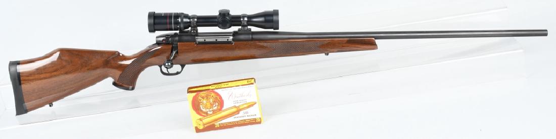 WEATHERBY MARK V .340 WBY MAG. RIFLE & SCOPE: SN PB019822, .340 Weatherby magnum caliber. 26" barrel with excellent bore. 98% low luster blue finish and excellent checkered wood stock. Action is tight. Includes Weatherby Supreme scope with 2-7X34