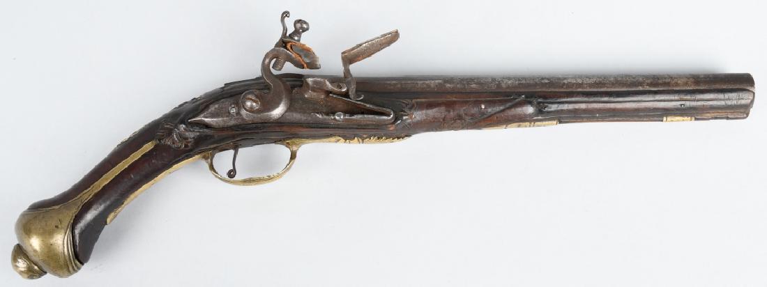 ANTIQUE MIDDLE EASTERN .64 FLINTLOCK PISTOL: Impressive early 19th century Middle eastern flintlock pistol. Measures 18 1/2" overall with a 11'".64 caliber barrel. Pistol is in original flintlock configuration, and the action works. The gun has