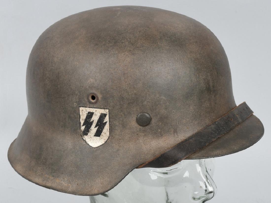 WWII NAZI GERMAN M 42 SS SINGLE DECAL HELMET: This is your typical late war EF M42 SS helmet in standard slate gray reminiscent of a very dark Coke bottle green. What I have always found to be interesting about M42 EF helmets is the strange way i