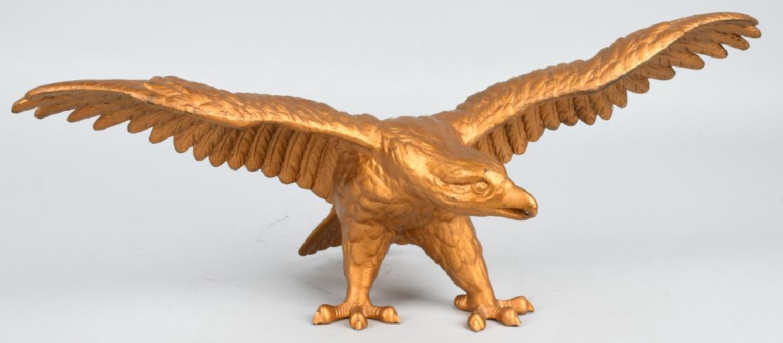 WWII NAZI CAST ALUMINUM EAGLE STATUE: Large cast aluminum Nazi Eagle statue. Very nice detailed casting. Has a gold painted finish. There is a small hole in the beak where something would have hung at one time. Eagles wingspan measures 24