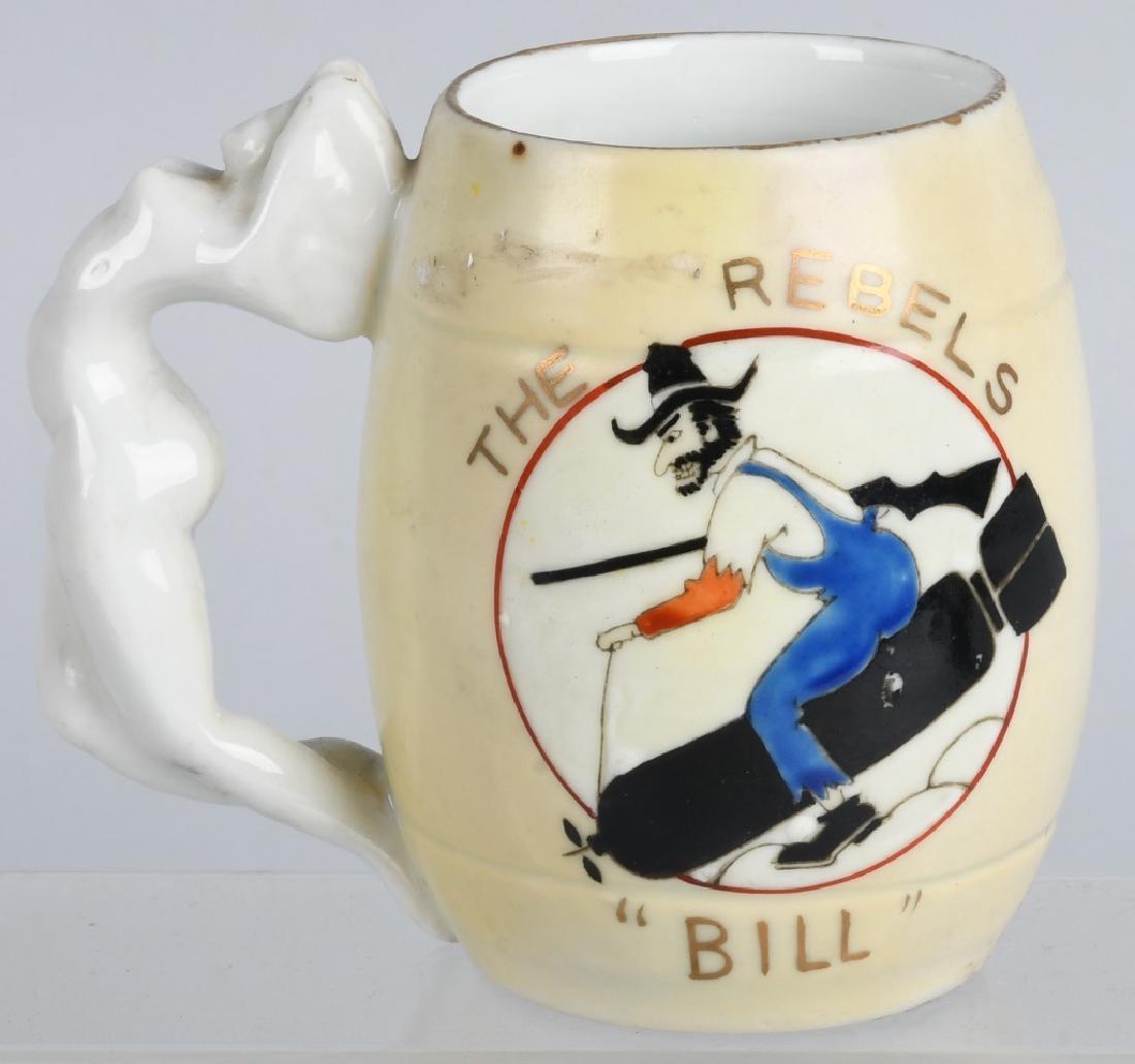 USAF 730th BOMB SQUADRON "THE REBELS" MUG: Excellent original USAF 730th Bomb Squadron "The Rebels" Mug. Has painted decoration of Rebel riding a Bomb. Says The Rebels and Bill. Ceramic mug with nude girl for the handle. Has Japanese markings