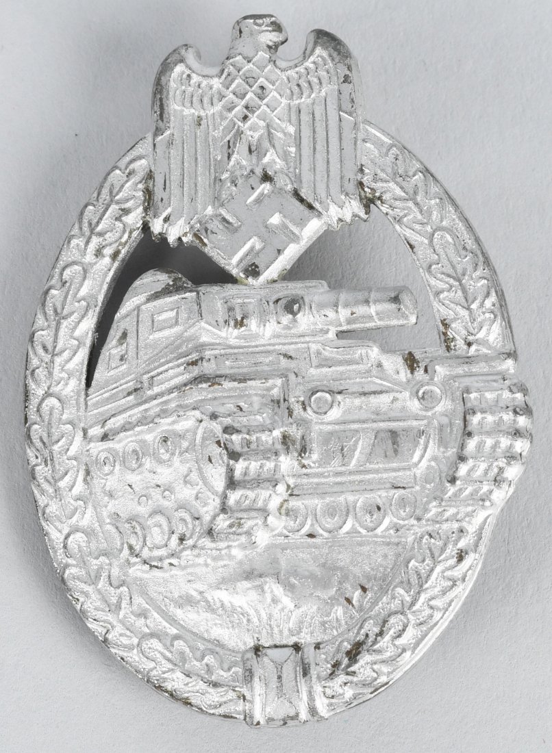 WWII NAZI GERMAN PANZER ASSAULT BADGE IN SILVER: Panzer assault badge in silver. unmarked. The badge is in the form of a vertically oval oak-leaf wreath with a Wehrmacht style eagle with down-swept wings, superimposed to the top center, encompassing