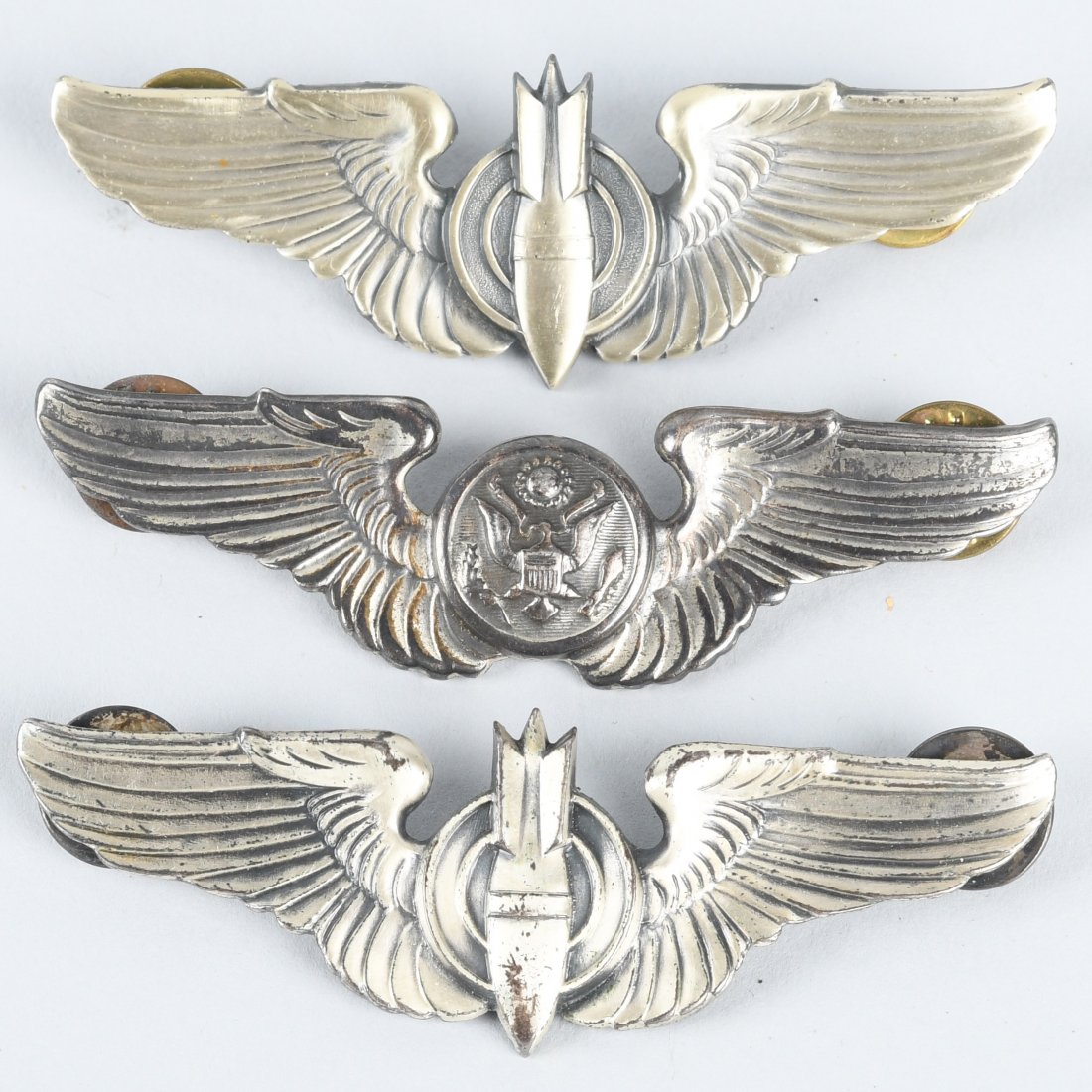 WWII ERA U.S. AAF WINGS BOMBARDIERS & AIR CREW: Three sets of World War Two era clutch back wings including 2 sets of bombardier wings and one set of air crew wings. All 3 sets are unmarked.