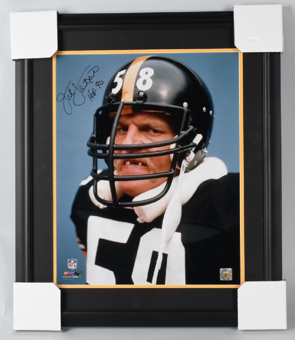 JACK LAMBERT PITTSBURG STEELERS SIGNED PHOTO: Signed 16X20 color photo matted and framed and signed with black sharpie with 'HOF' inscription. This is the famous photo of Jack staring with missing teeth. Jack Lambert hologram, mint.