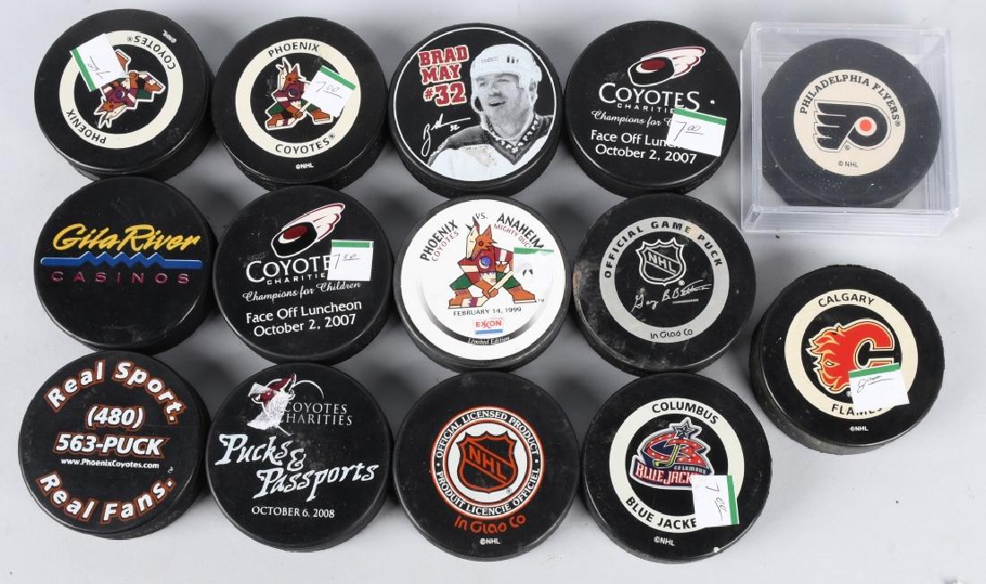 15- SOUVENIR HOCKEY PUCKS: Includes Phoenix Coyotes, Columbus Blue Jackets, Dallas Stars, and More