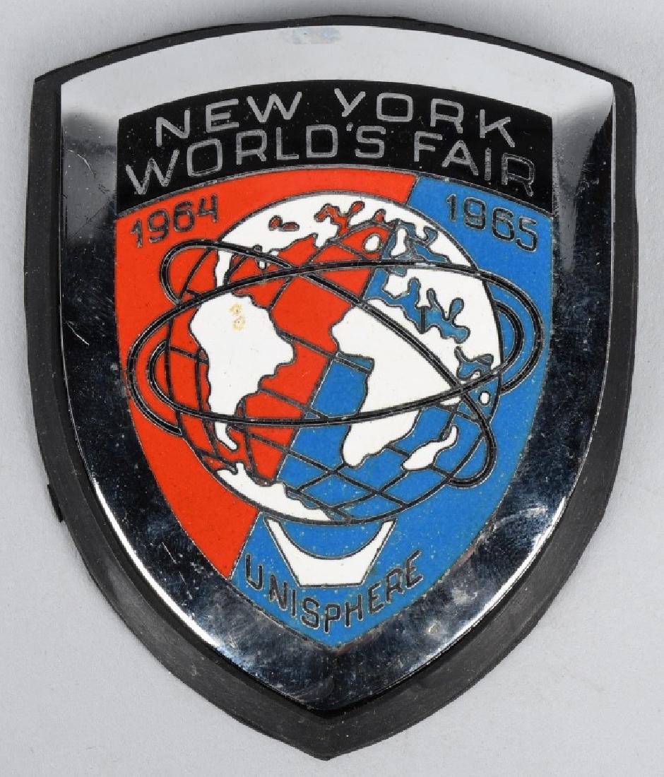 NEW YORK WORLDS FAIR CAR BADGE: 1964-65 New York Worlds Fair Car Badge. New old stock never used. Still has rubber mounting gasket. 3" Near Mint